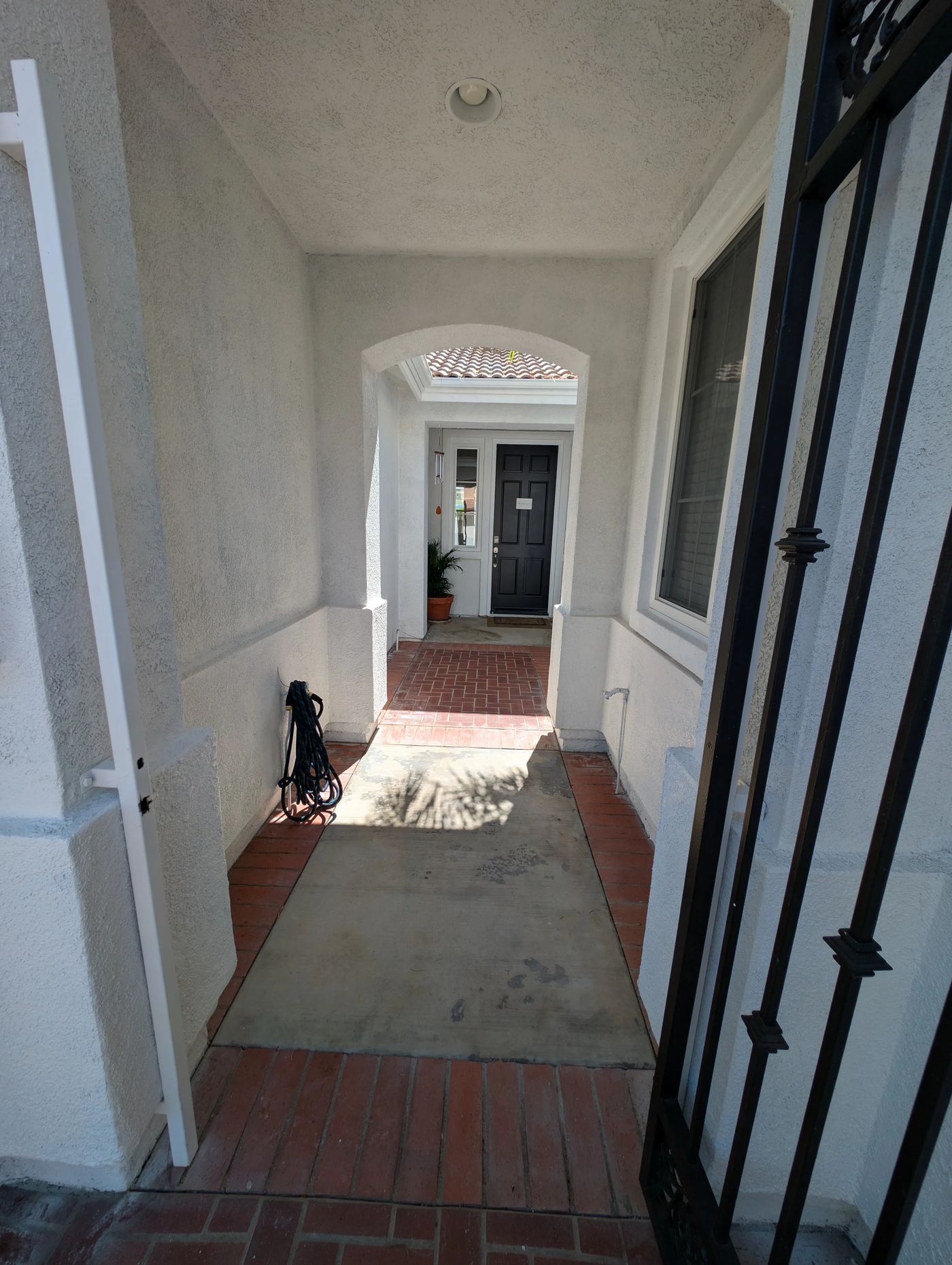 Covered entry walkway from the gate to the front door — Soleil Levant Care
